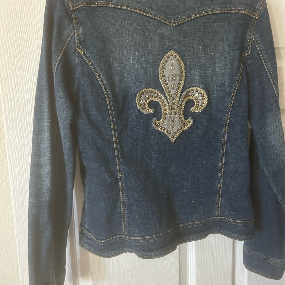 Unique S Denim Jacket embellished w fluer de leis studded back, very flattering.